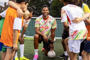 Joleon Lescott with young footballers
